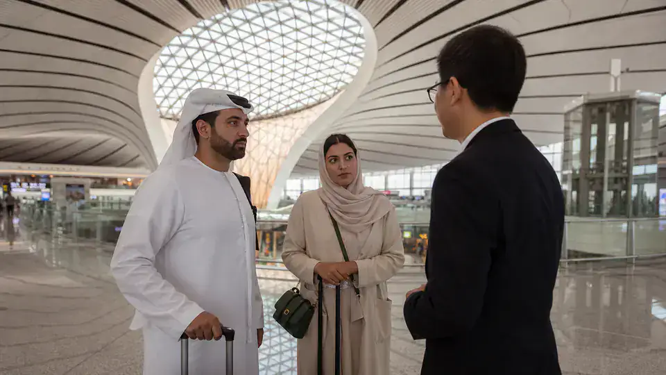 UAE couple meeting a chauffeur inside Beijing Daxing International Airport