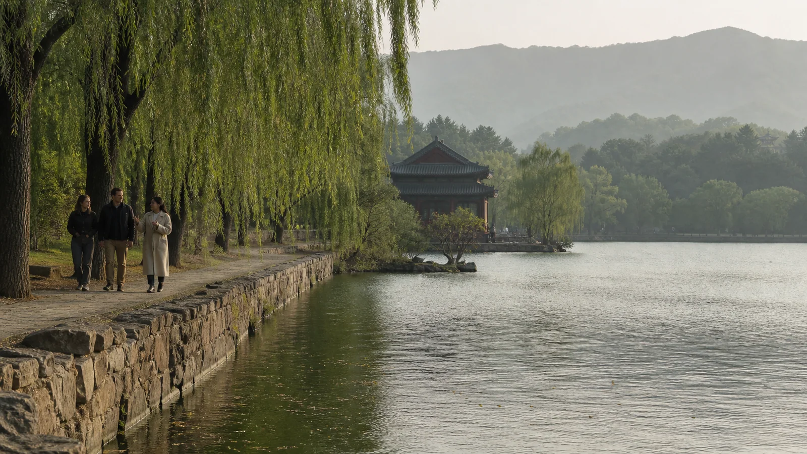 Travelers walking beside the lake in Chengde Mountain Resort