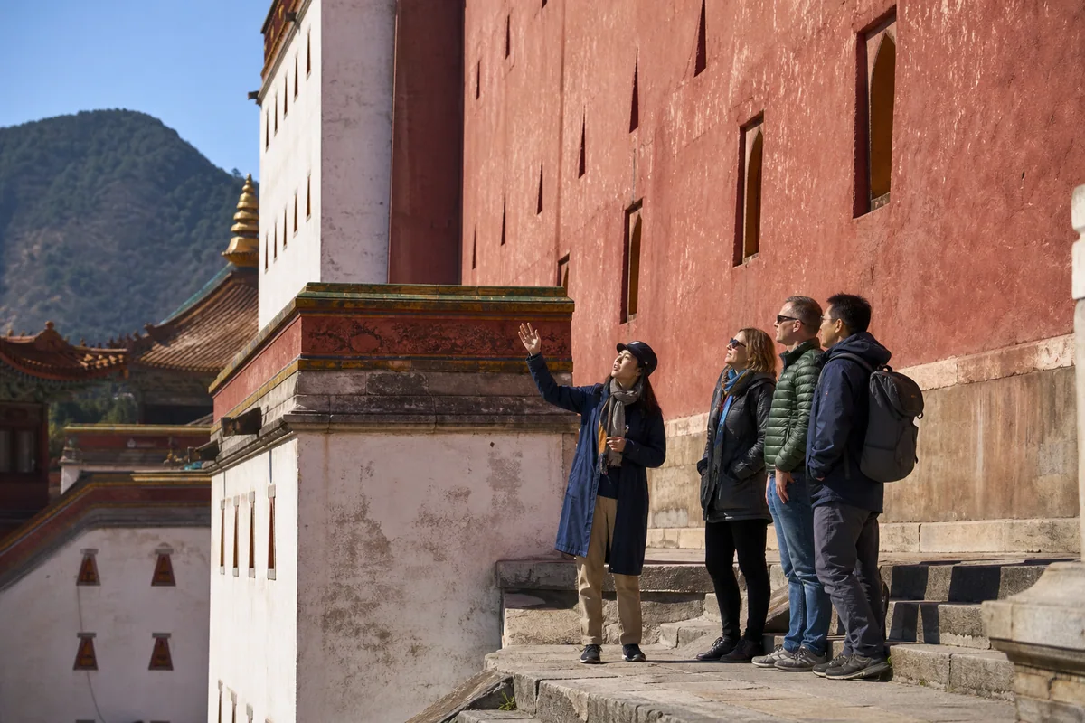 International travelers visiting Putuo Zongcheng Temple with a local guide in Chengde