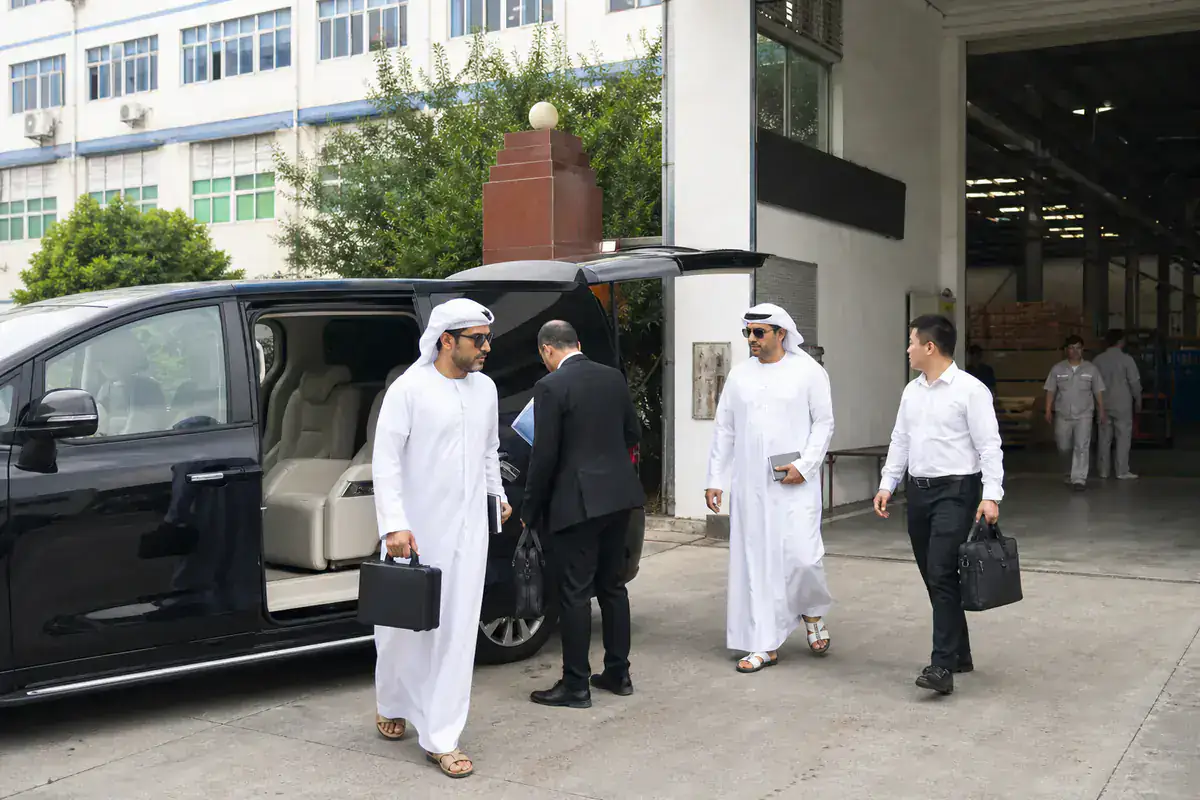 UAE buyers boarding an executive MPV after a Guangdong factory inspection