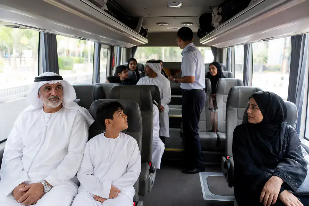 Gulf travelers seated inside a premium mini coach in China