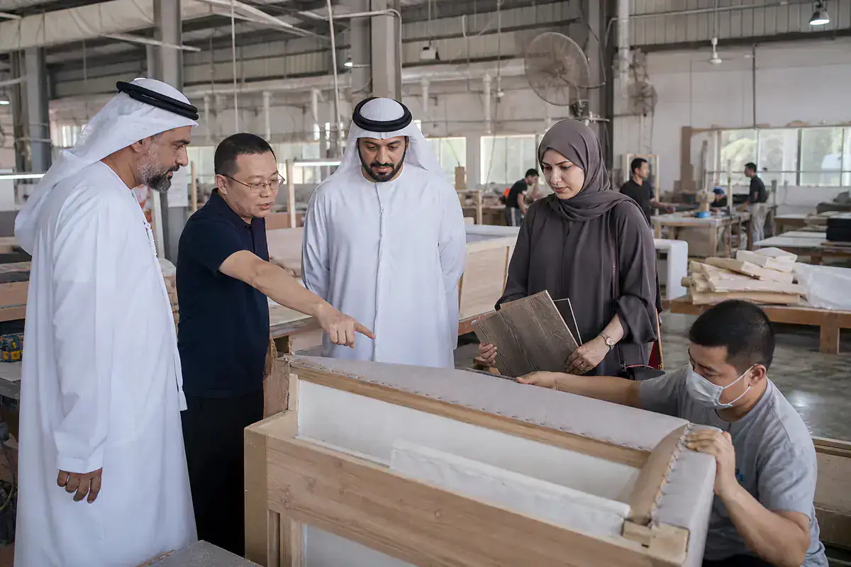 UAE furniture buyers inspecting production inside a Foshan factory