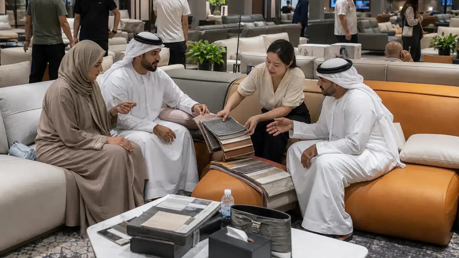 UAE furniture buyers comparing upholstery in a Lecong showroom