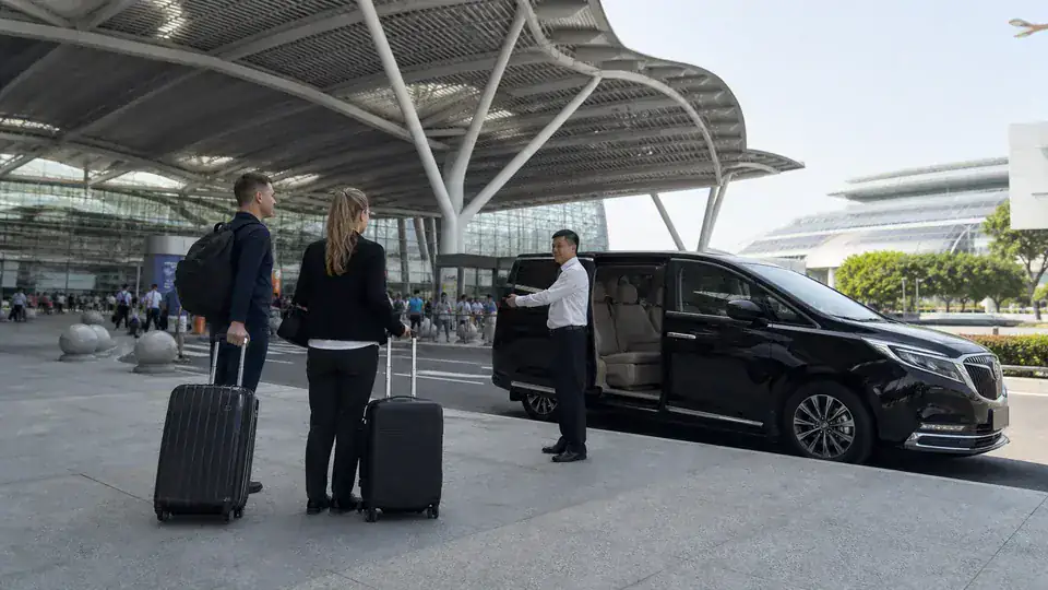 International Canton Fair buyers meeting a private chauffeur outside Guangzhou South Railway Station