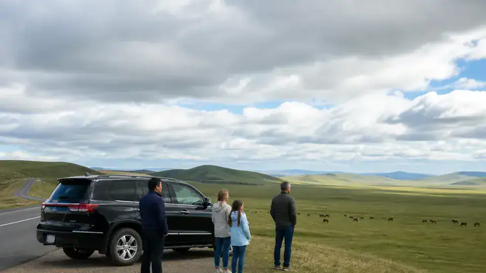 International family and private chauffeur at a legal Hulunbuir grassland road viewpoint