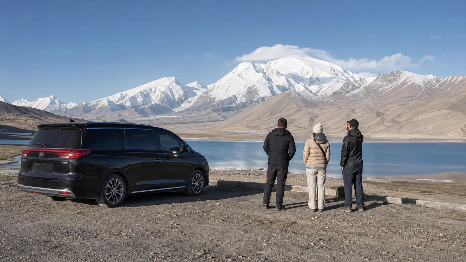 Travelers and a private driver viewing Muztagh Ata beside Karakul Lake on the Pamir Highway