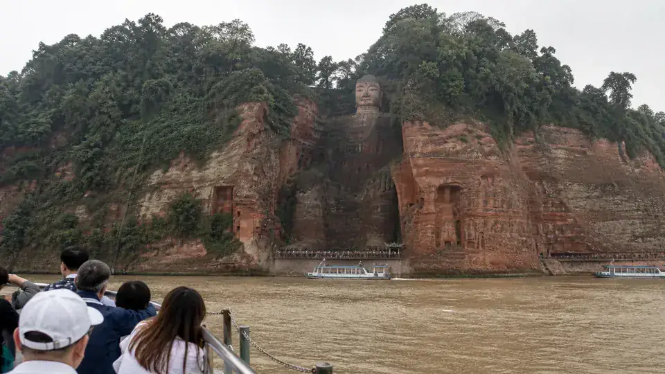 Leshan Giant Buddha viewed from a sightseeing boat on the river