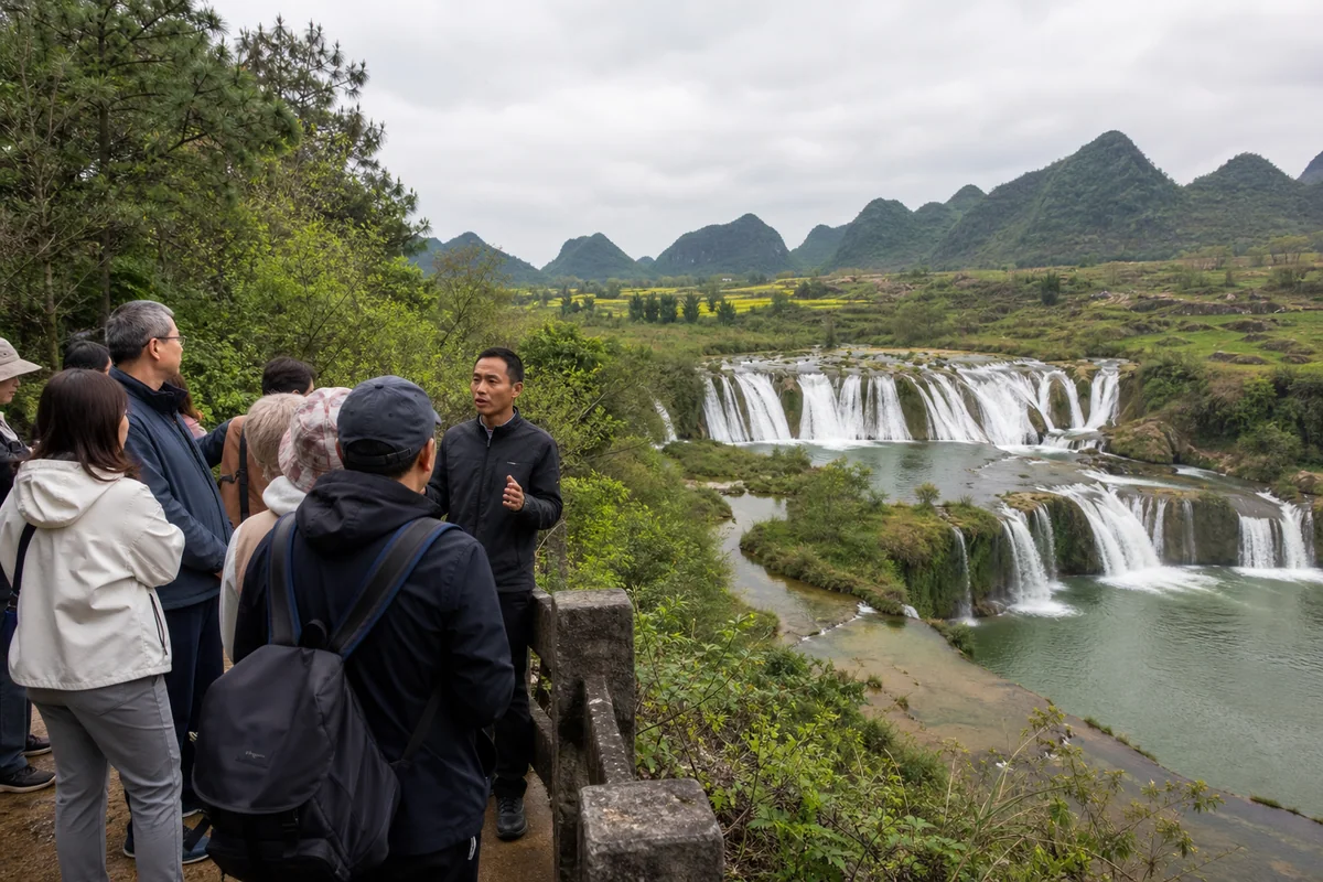 Travelers and local guide at a safe viewpoint above Jiulong Waterfalls near Luoping