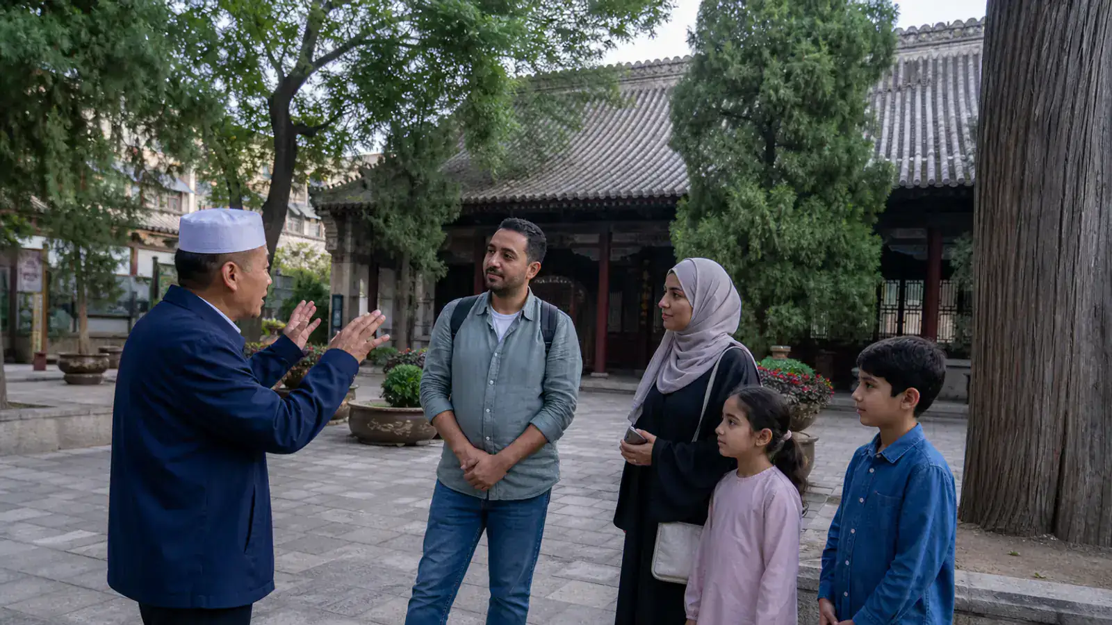 Gulf Muslim family visiting Xi’an Great Mosque with a local Chinese Muslim guide