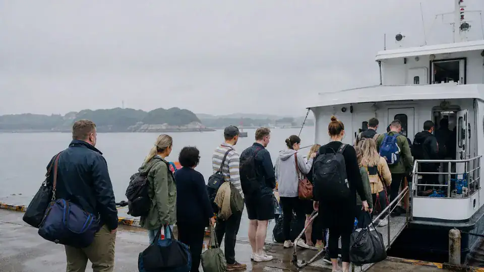 International travelers boarding a passenger ferry for Putuoshan Island