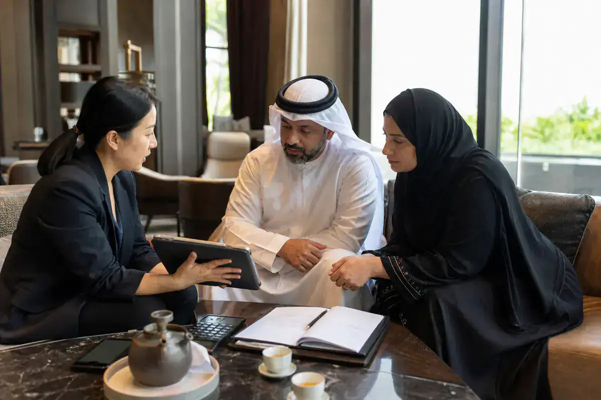 UAE couple reviewing a private China quotation with a coordinator