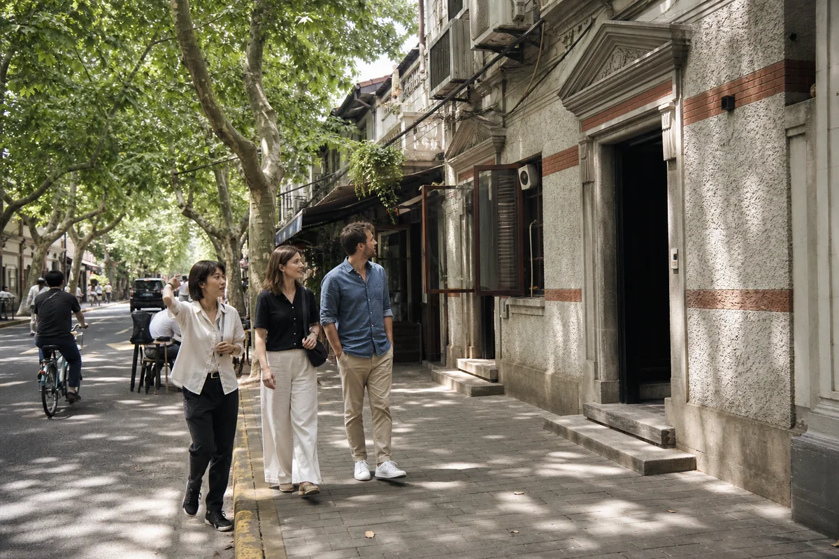International couple exploring a tree lined Xuhui street with a local guide