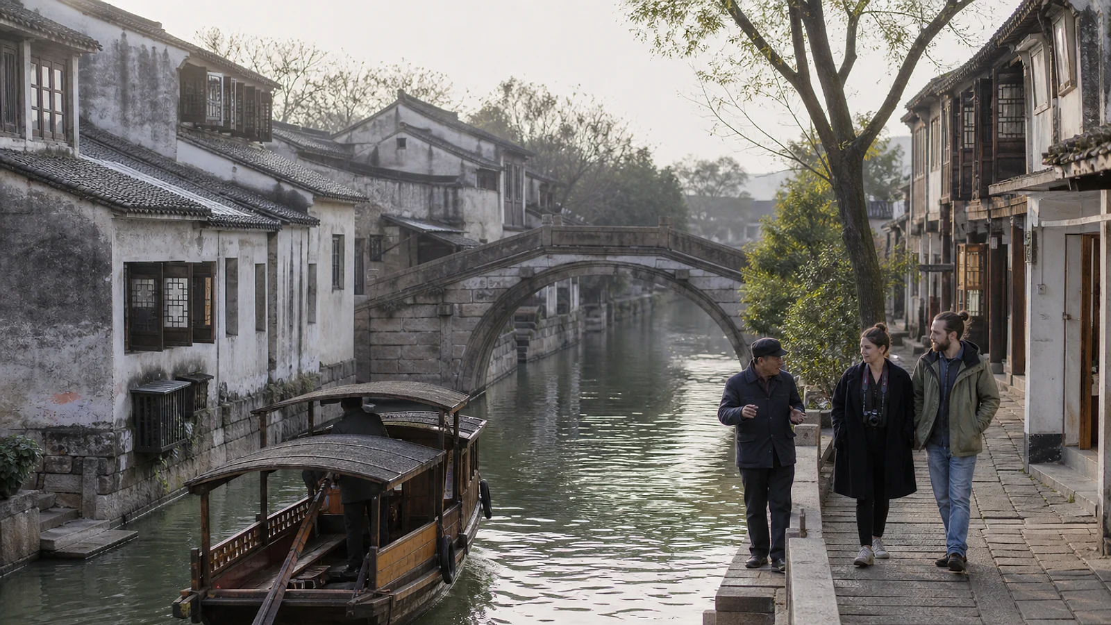 Travelers and a local guide beside a quiet canal and stone bridge in Nanxun water town