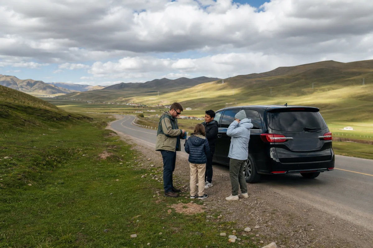 International family and chauffeur at a safe viewpoint near Sangke grassland outside Xiahe