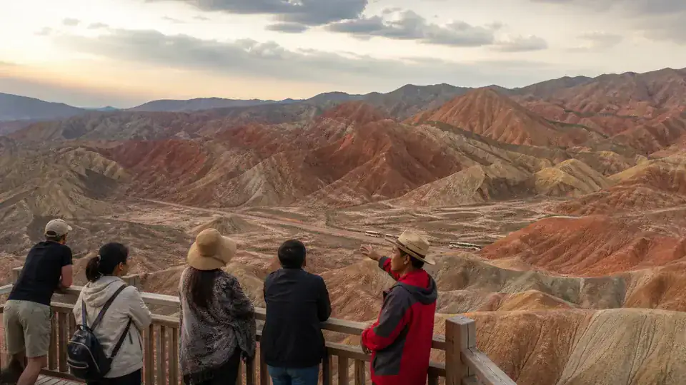 Travelers viewing the natural colors of Zhangye Colorful Danxia near sunset