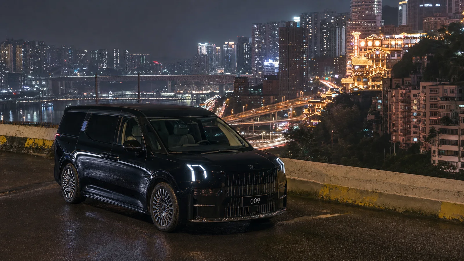 Black ZEEKR 009 overlooking Chongqing's layered roads at night