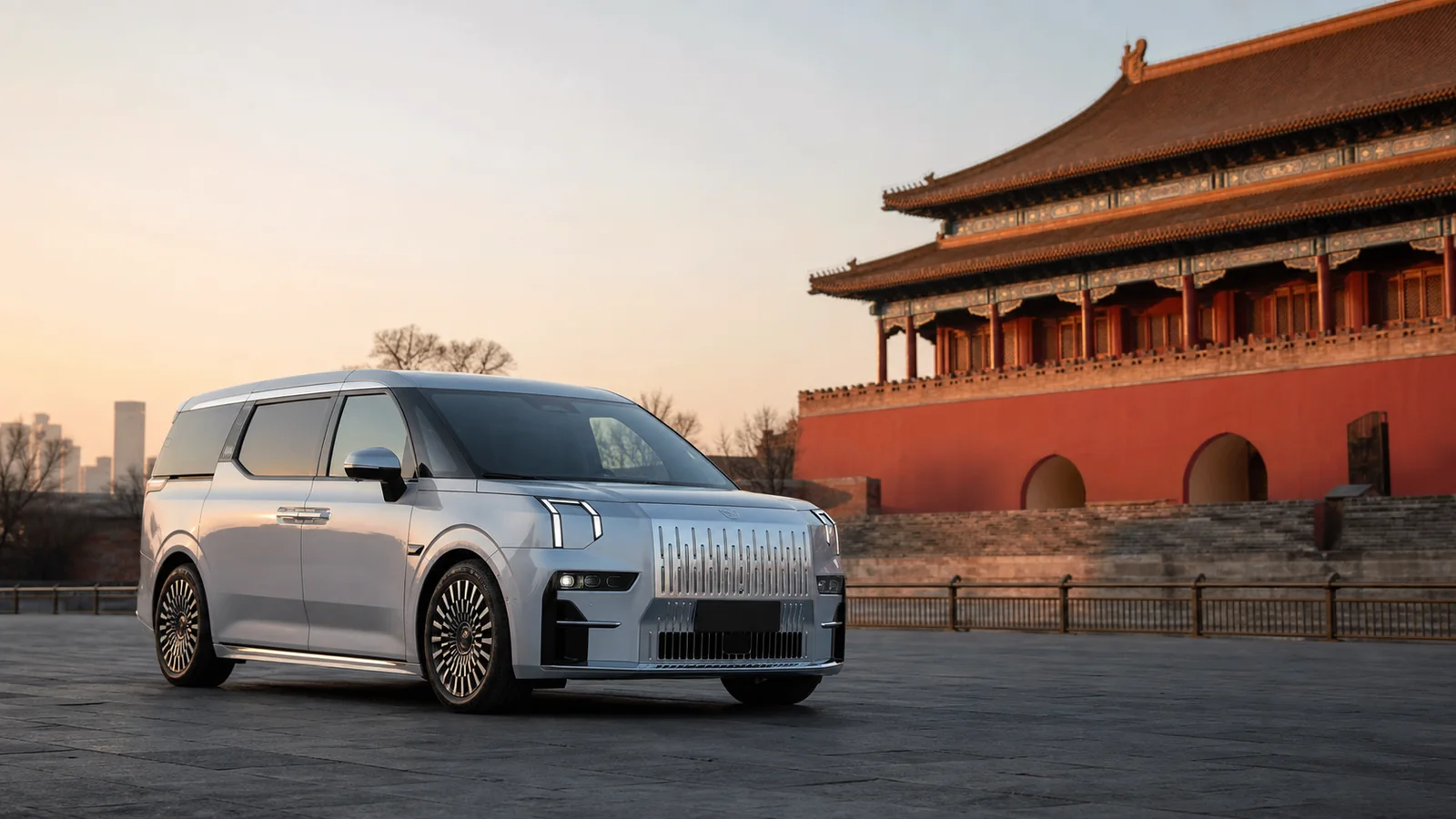 Silver ZEEKR 009 near Beijing's historic Central Axis at sunrise