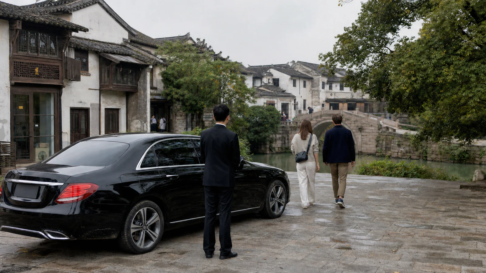 Two travelers arriving with a private chauffeur at Sanhe Ancient Town near Hefei