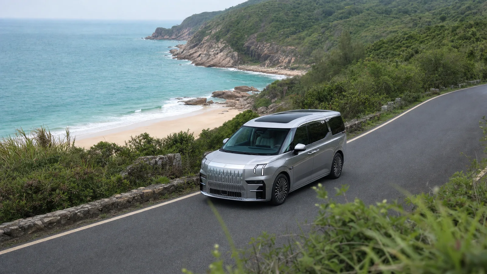 Silver ZEEKR 009 traveling along the coast of Shenzhen's Dapeng Peninsula