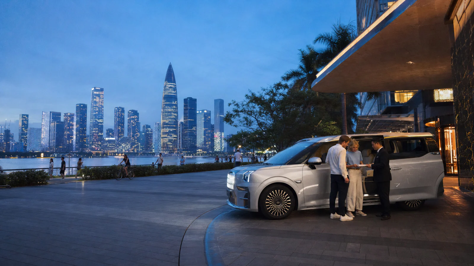 Private travelers and chauffeur beside an executive MPV on the Shenzhen Bay waterfront at blue hour