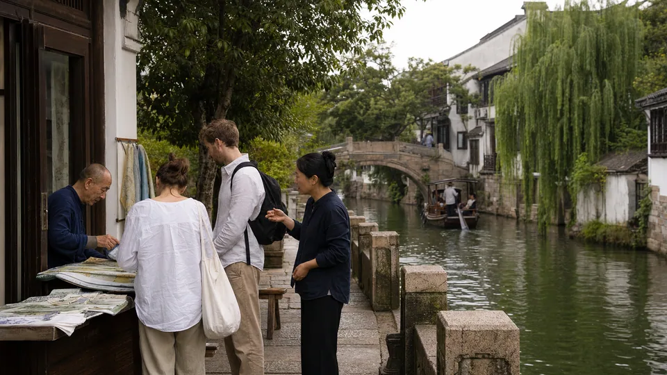 International visitors exploring a quiet Suzhou canal neighborhood with a local private guide