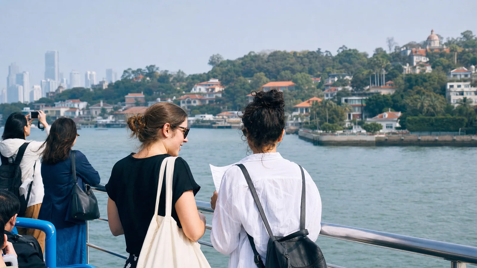 Visitors walking beside historic villas and subtropical greenery on Gulangyu Island