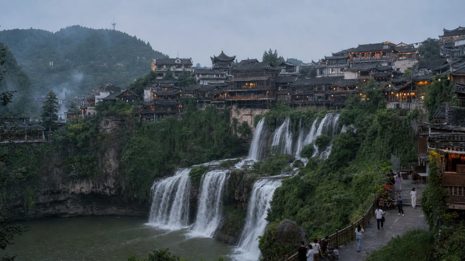 Furong Town houses and waterfall in western Hunan at dusk