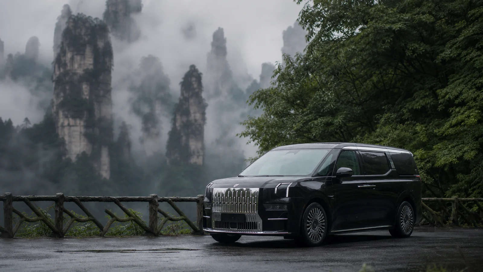 Black ZEEKR 009 on a misty forest road in Zhangjiajie